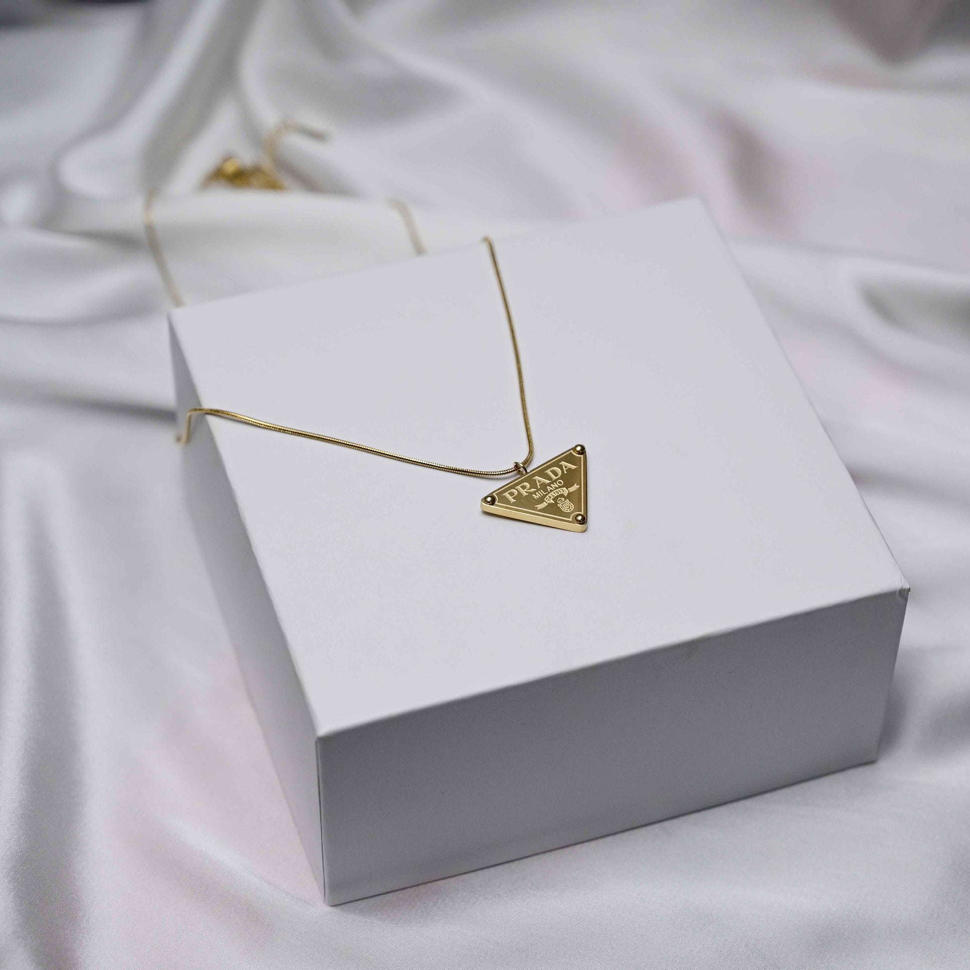 Prada symbol necklace in gold