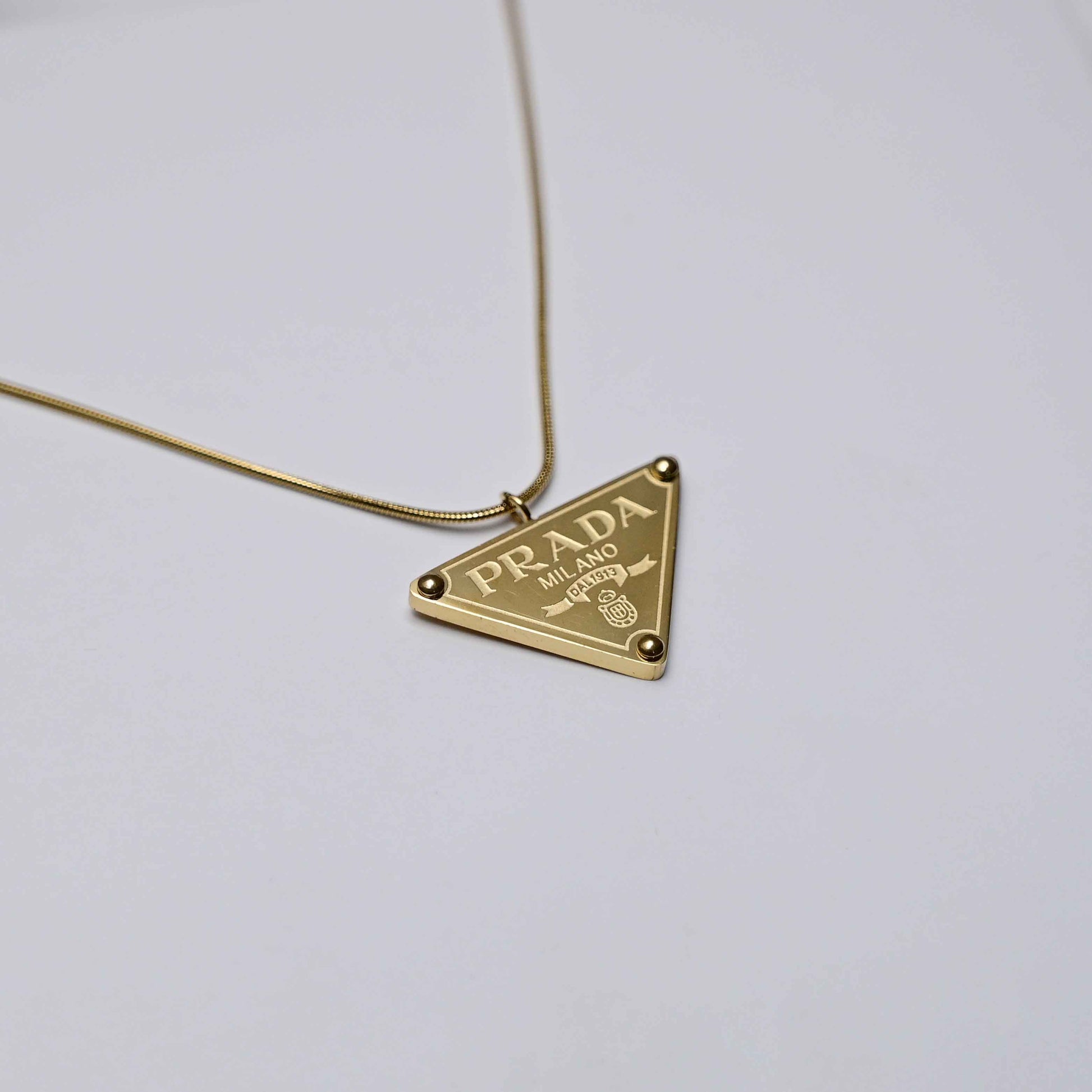 Prada symbol necklace in gold