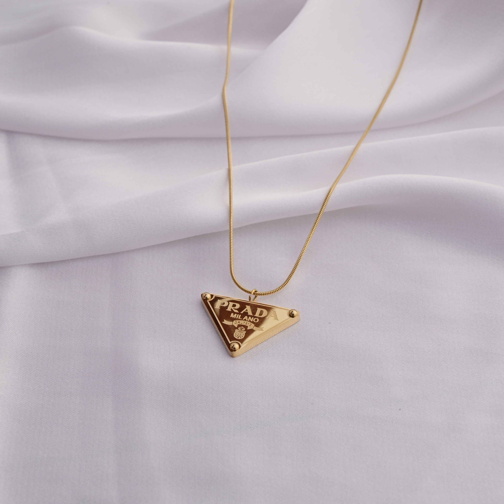 Prada symbol necklace in gold