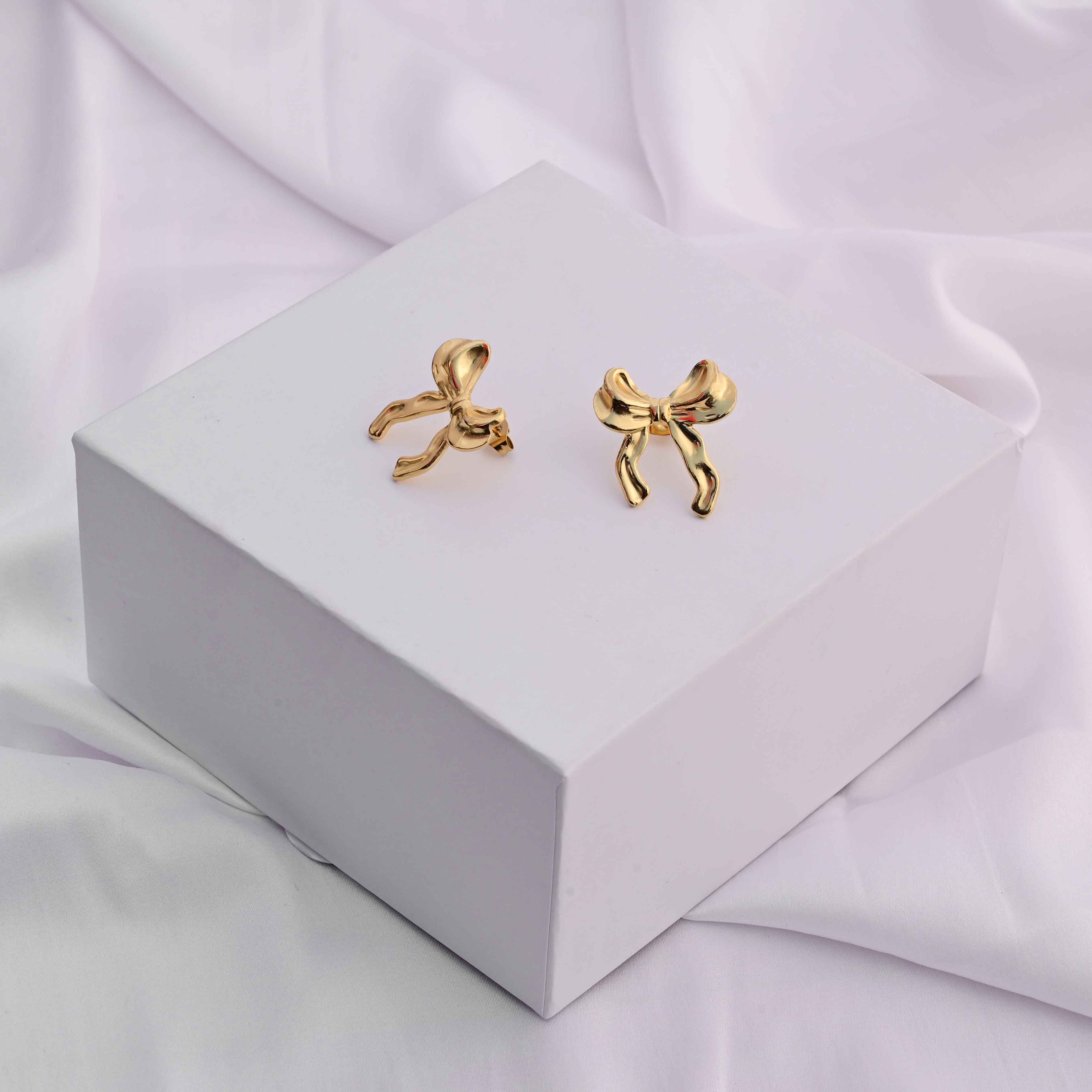 Bows earrings in gold