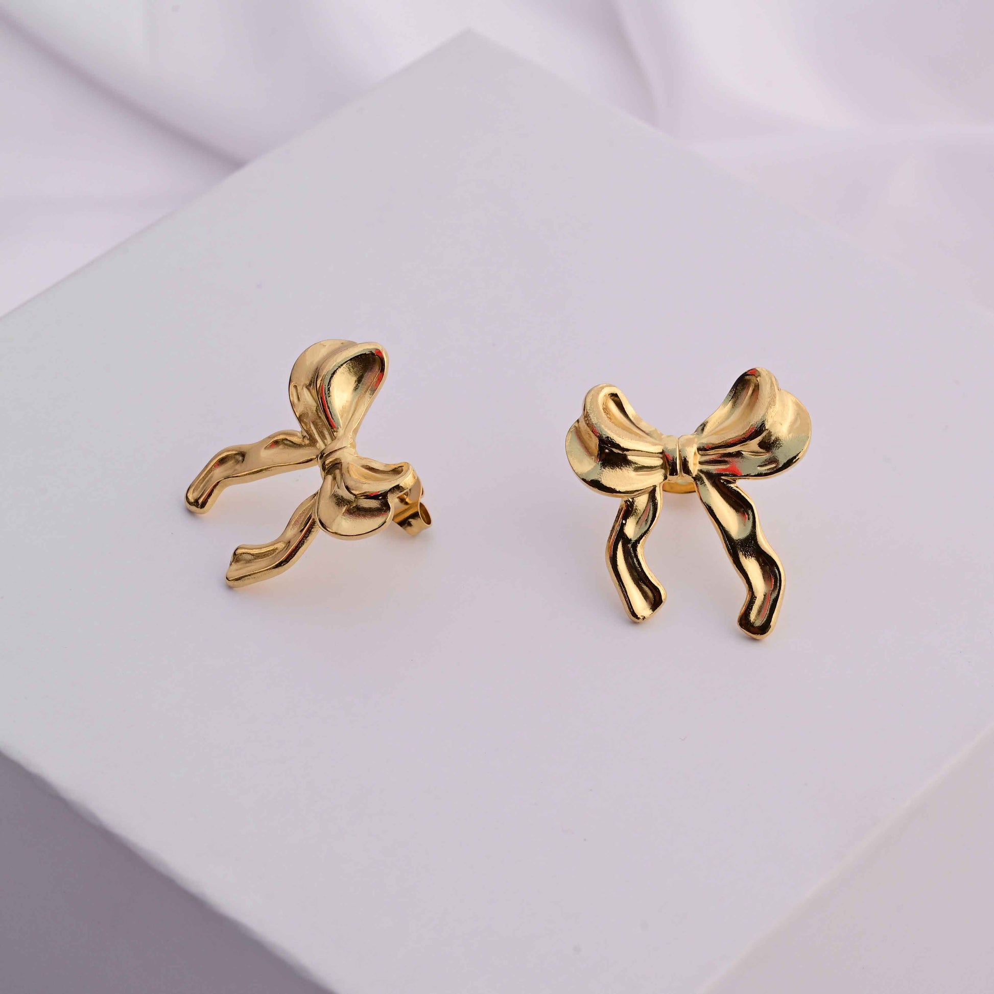 Bows earrings in gold