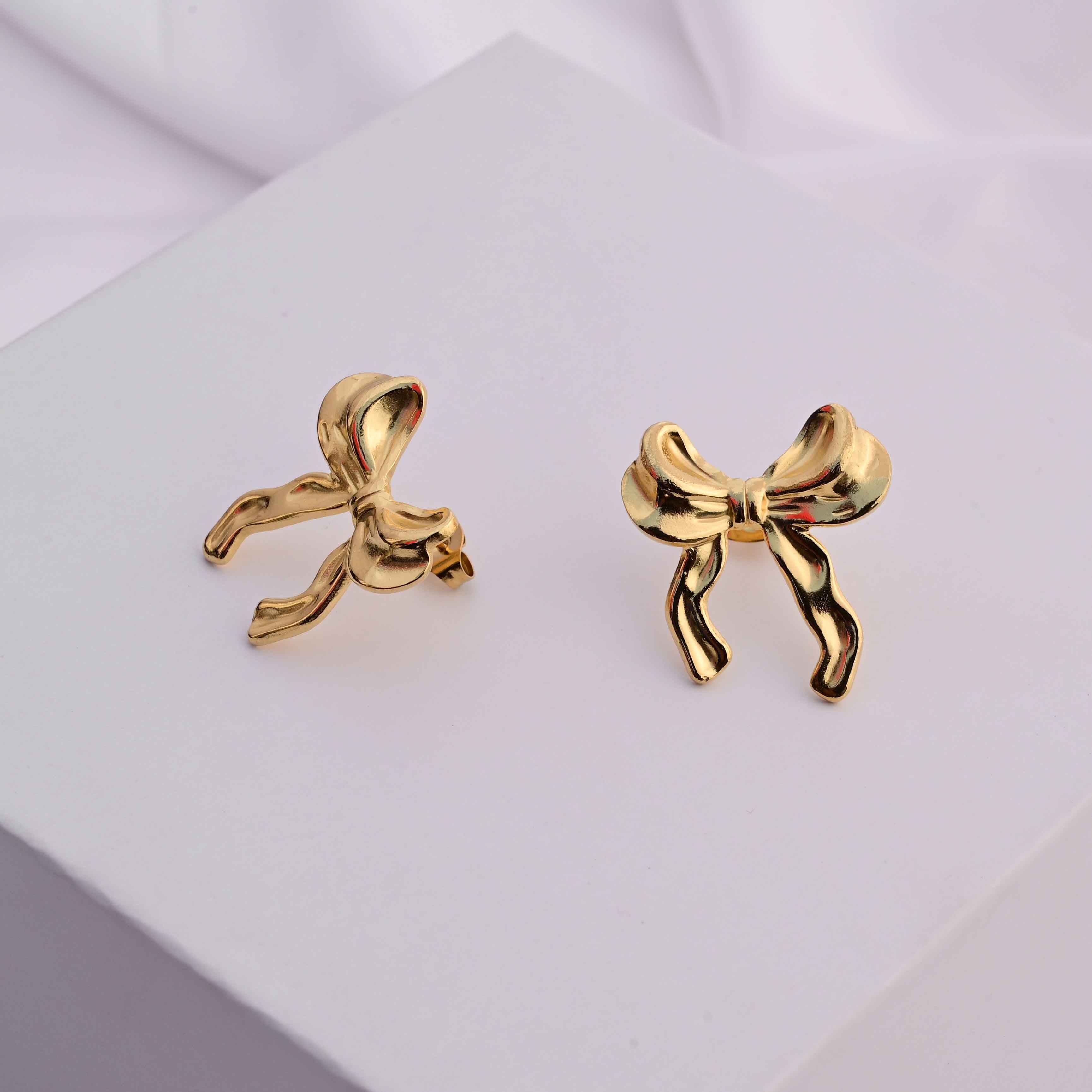 Bows earrings in gold