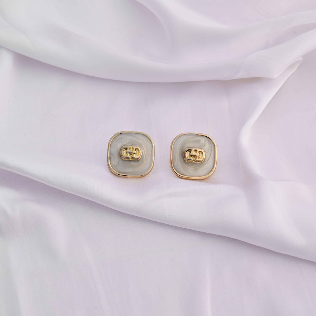 Square gold earrings with ivory enamel