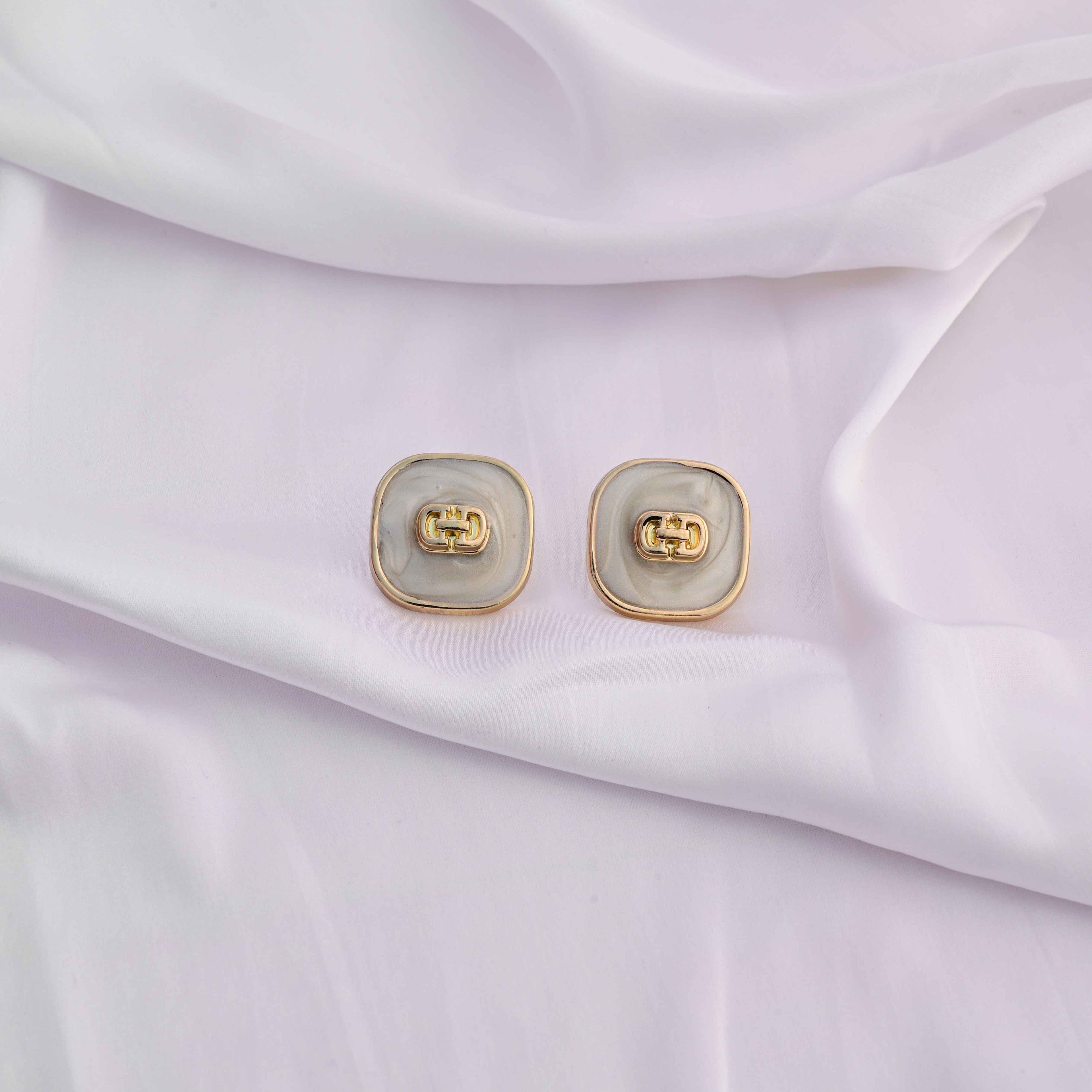 Square gold earrings with ivory enamel