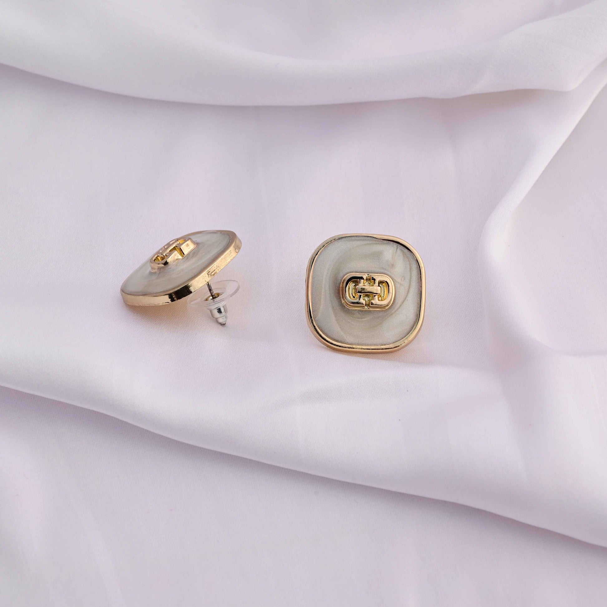 Square gold earrings with ivory enamel