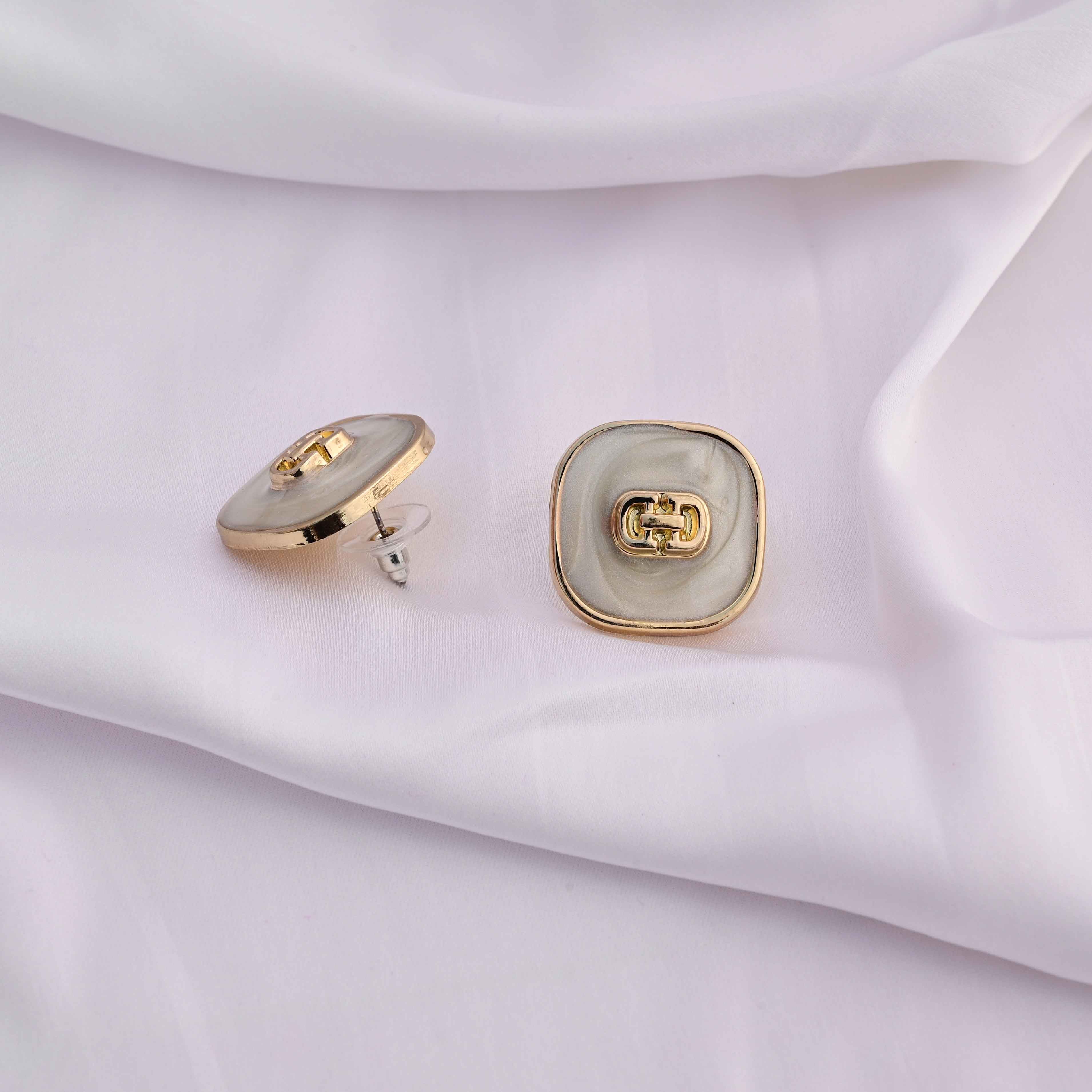 Square gold earrings with ivory enamel