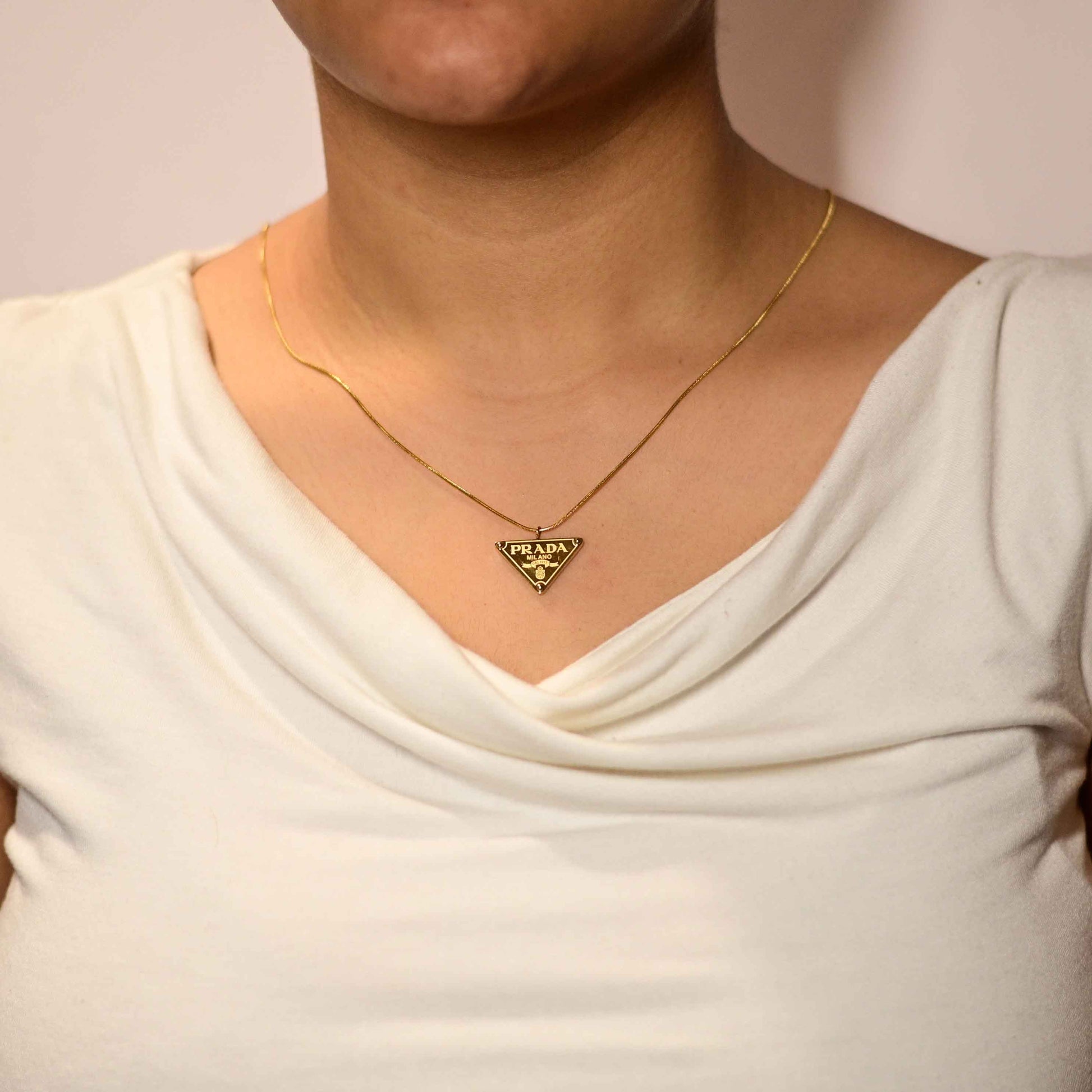 Prada symbol necklace in gold