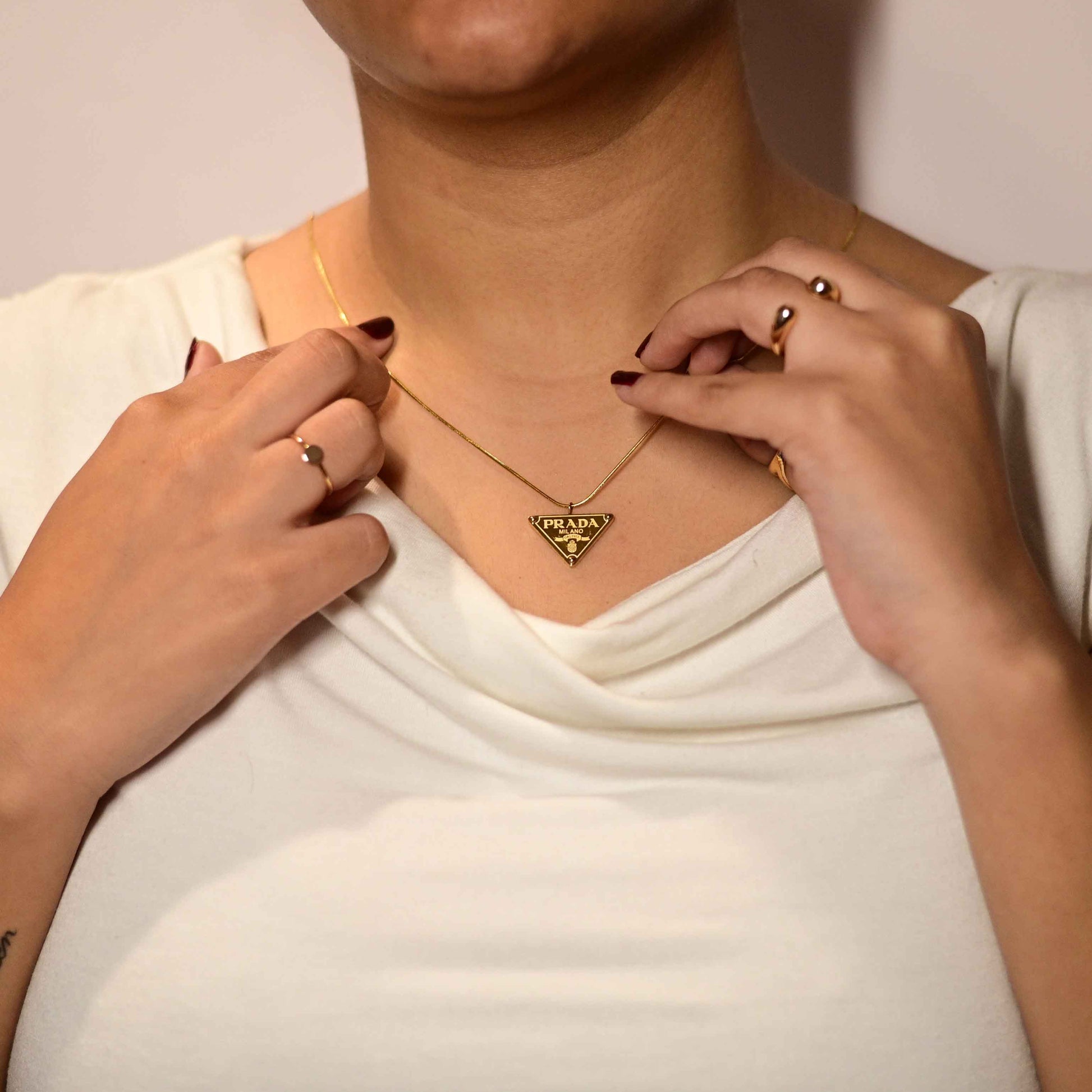 Prada symbol necklace in gold