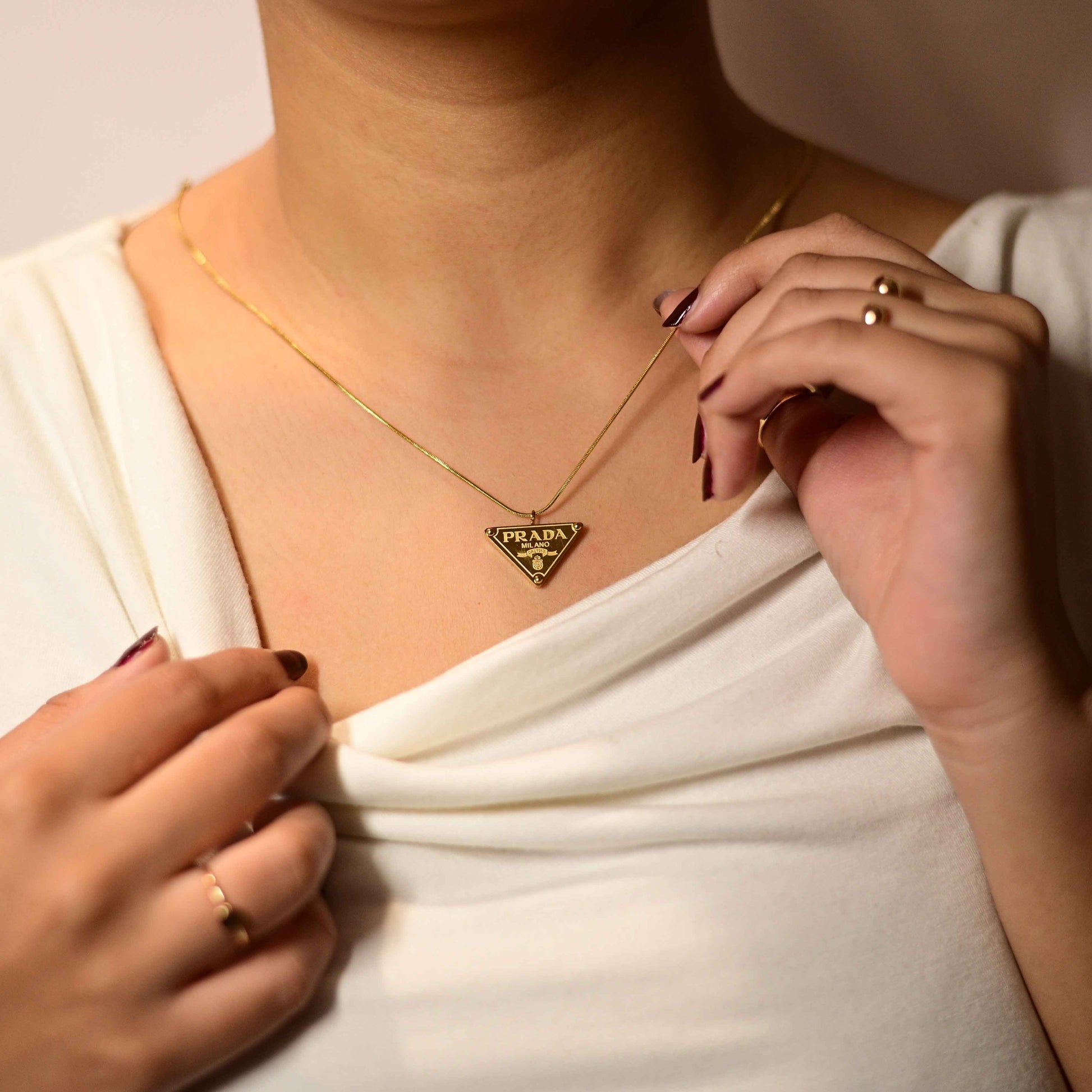 Prada symbol necklace in gold