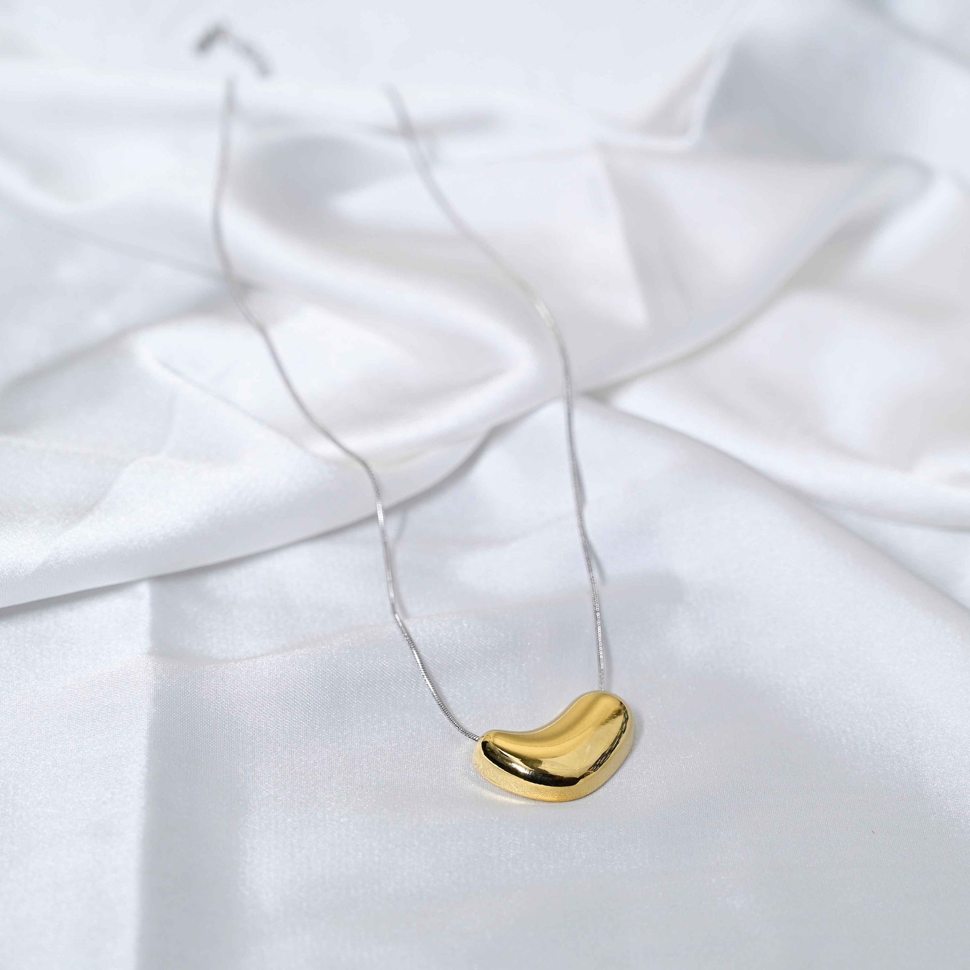 Molten Heart Necklace: Golden Heart with silver Chain