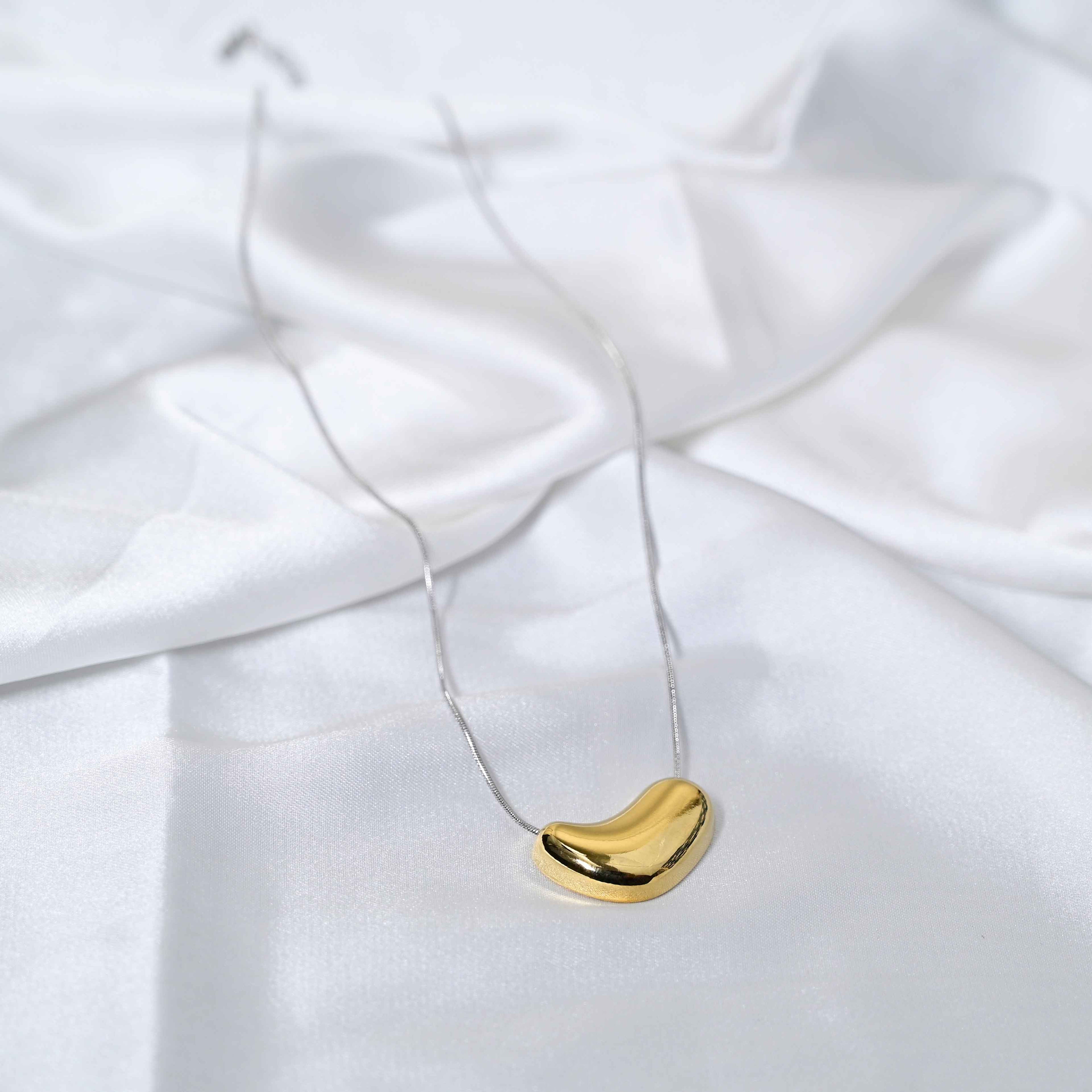 Molten Heart Necklace: Golden Heart with silver Chain