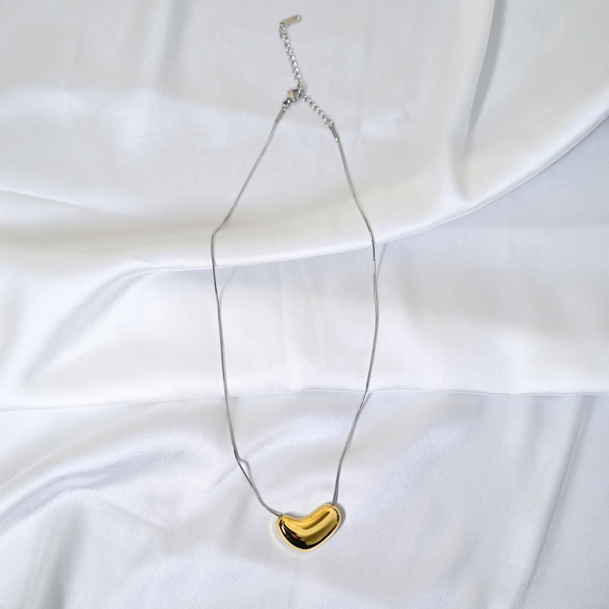 Molten Heart Necklace: Golden Heart with silver Chain