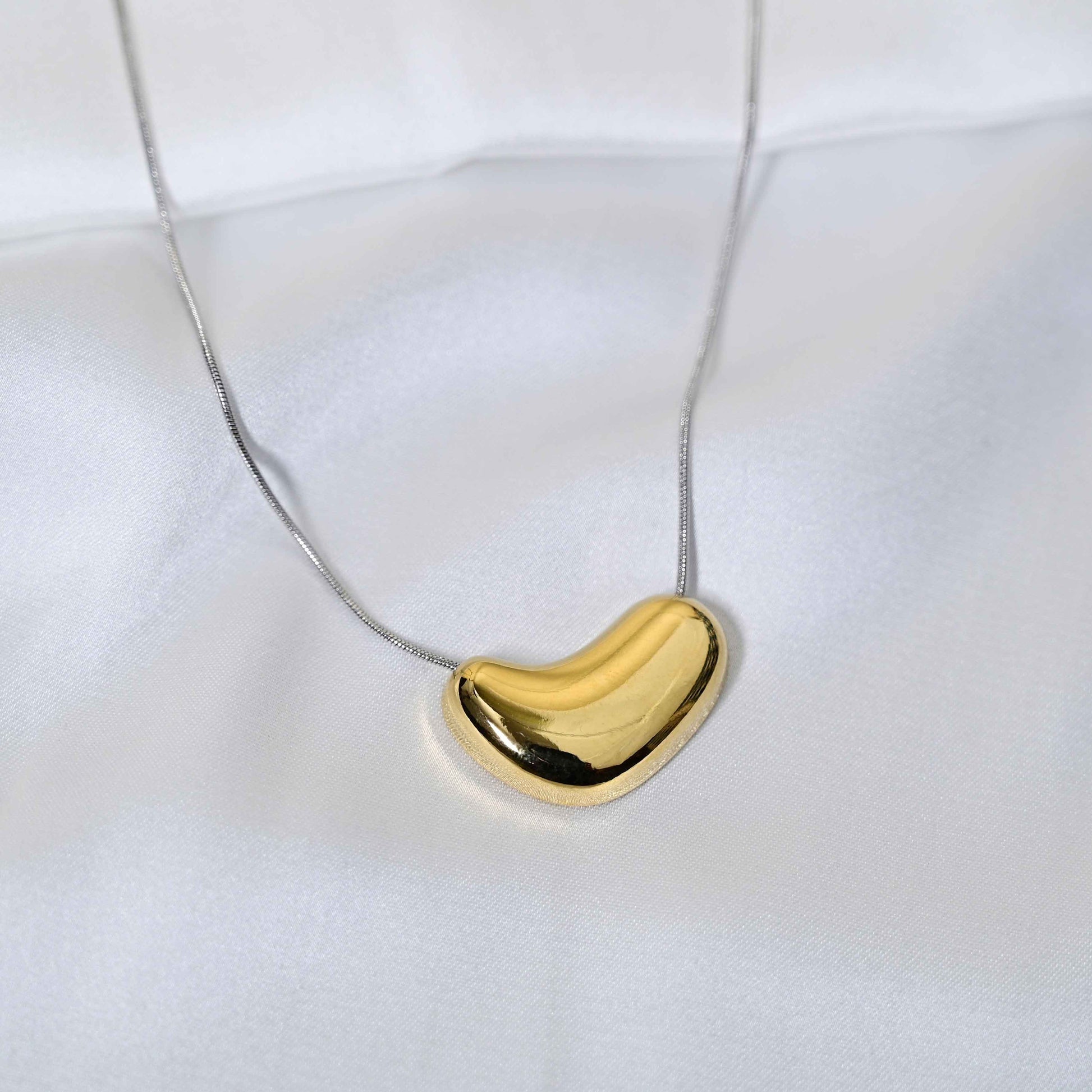 Molten Heart Necklace: Golden Heart with silver Chain