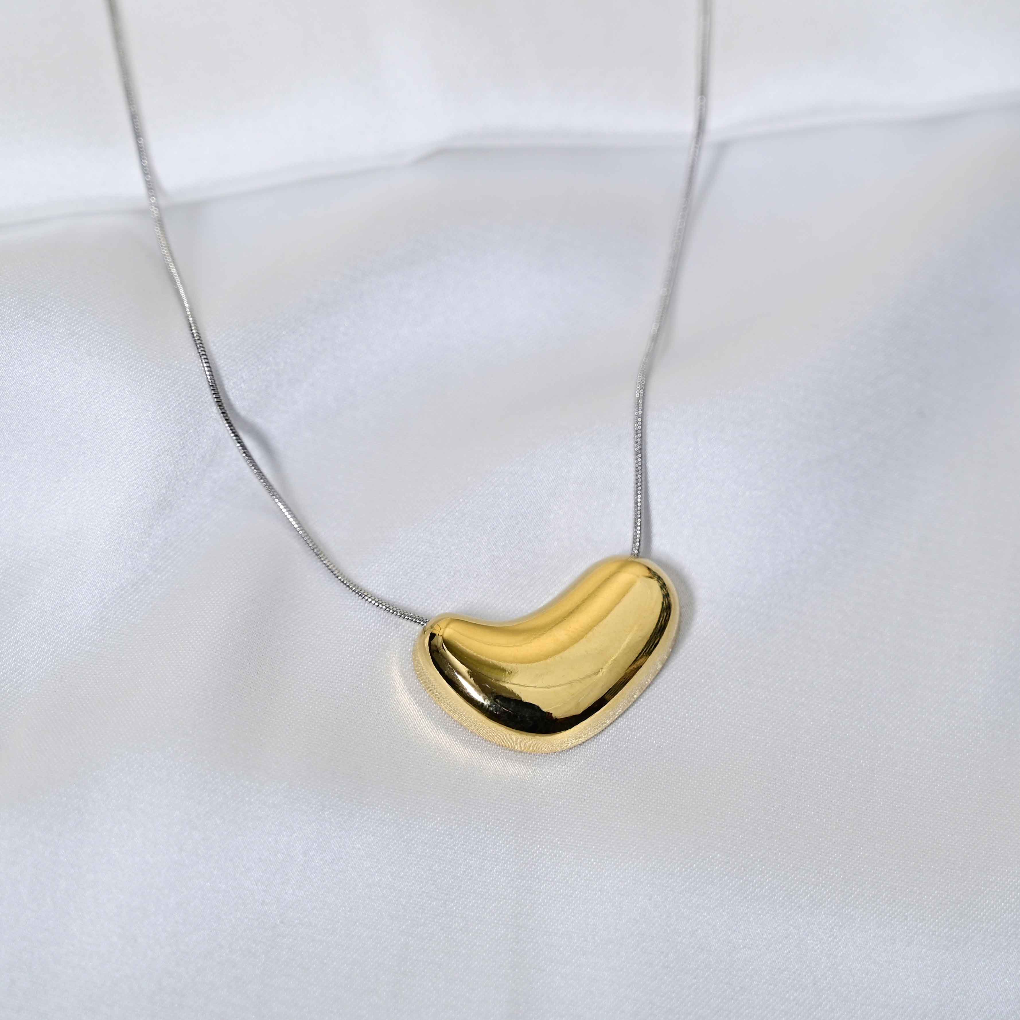 Molten Heart Necklace: Golden Heart with silver Chain