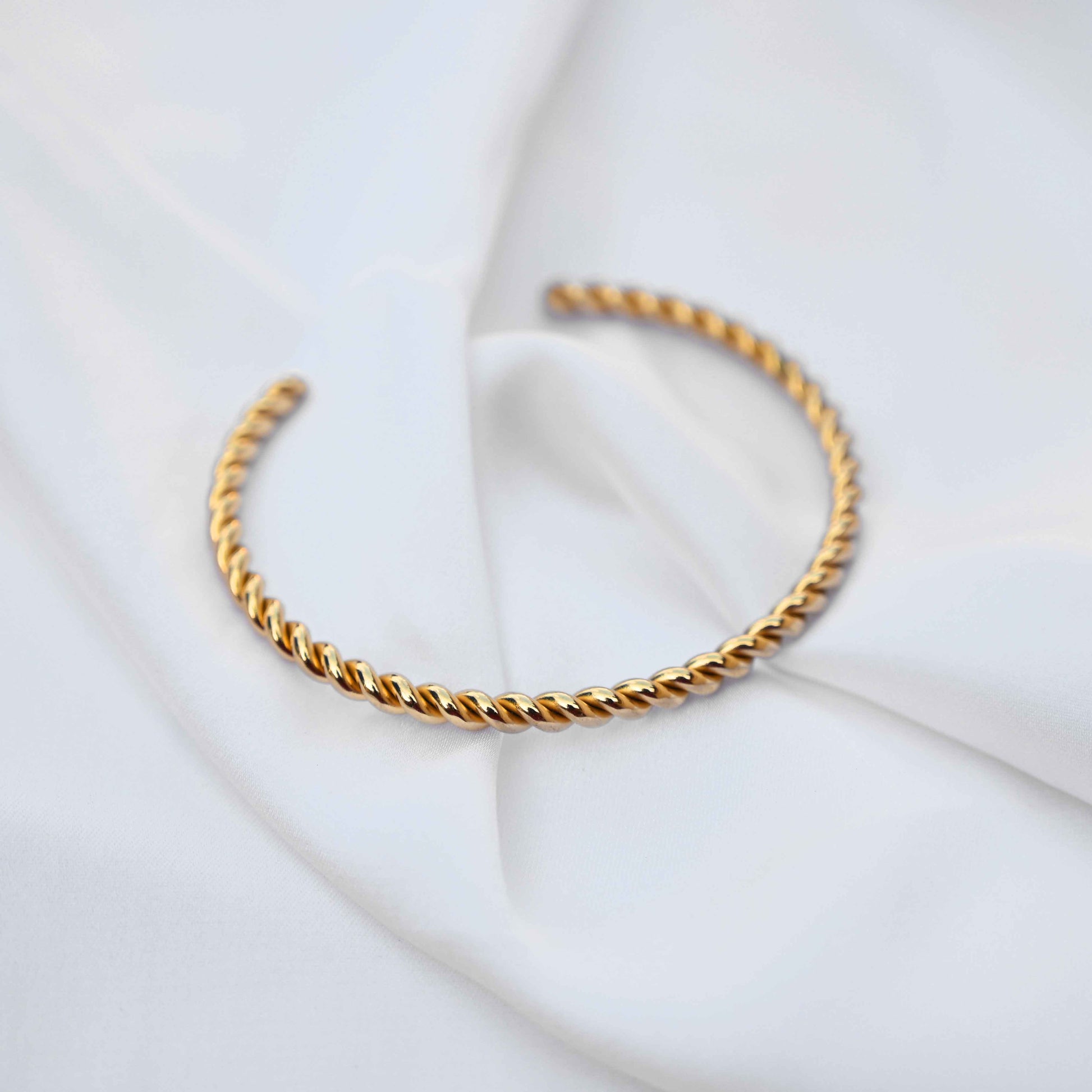 Twisted minimalistic gold bangle: anti Tarnish jewellery