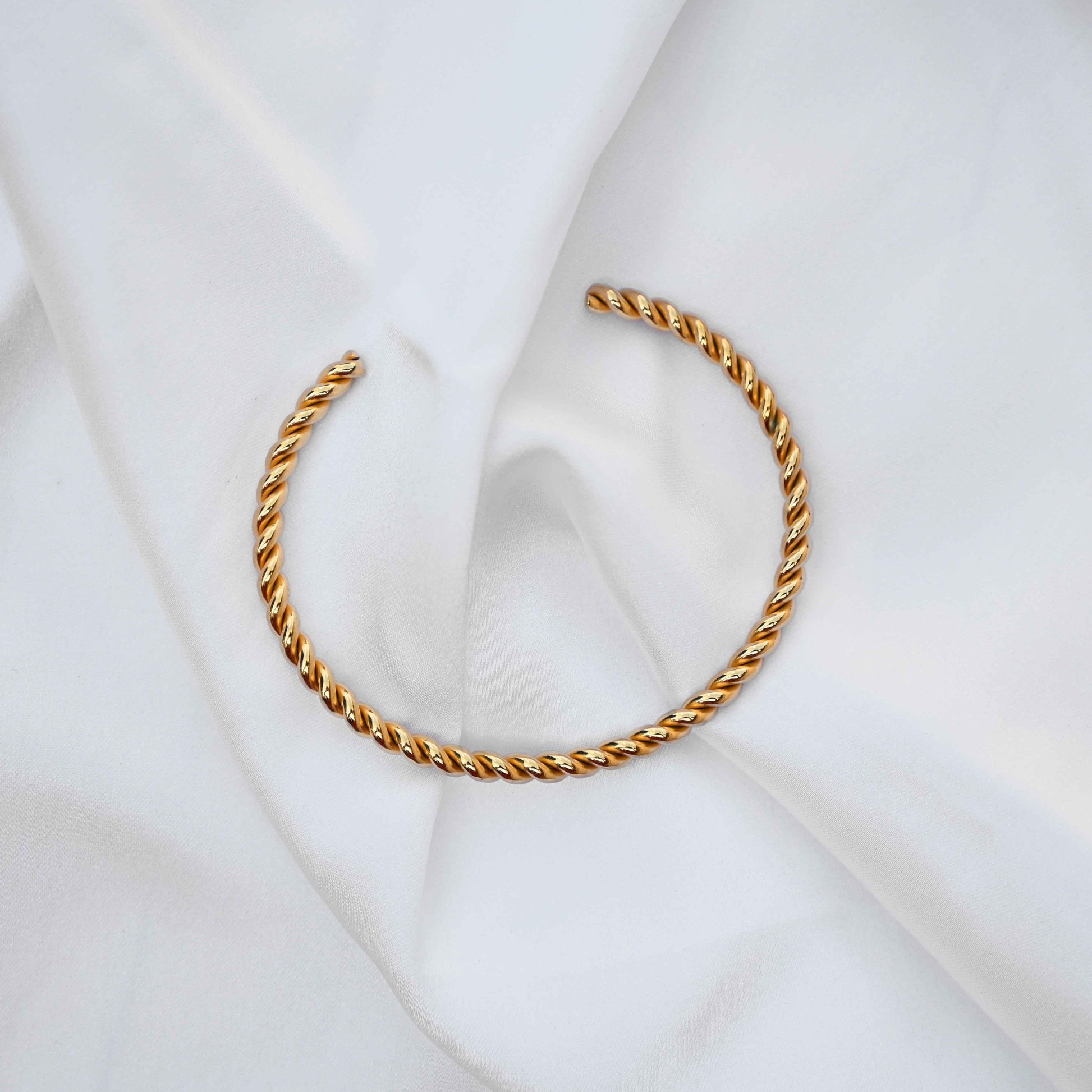 Twisted minimalistic gold bangle: anti Tarnish jewellery