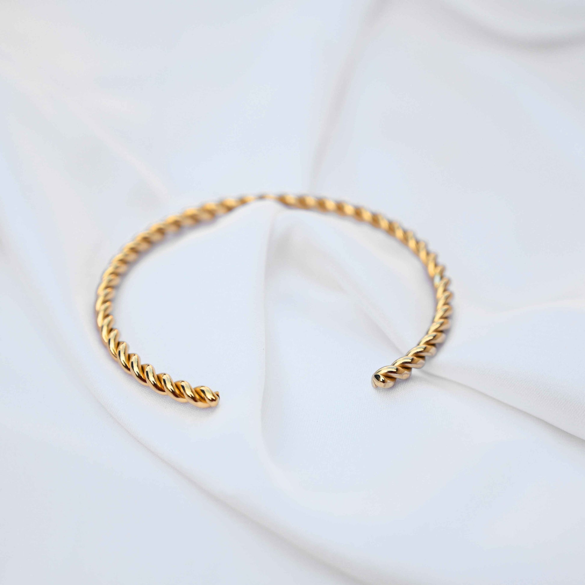 Twisted minimalistic gold bangle: anti Tarnish jewellery
