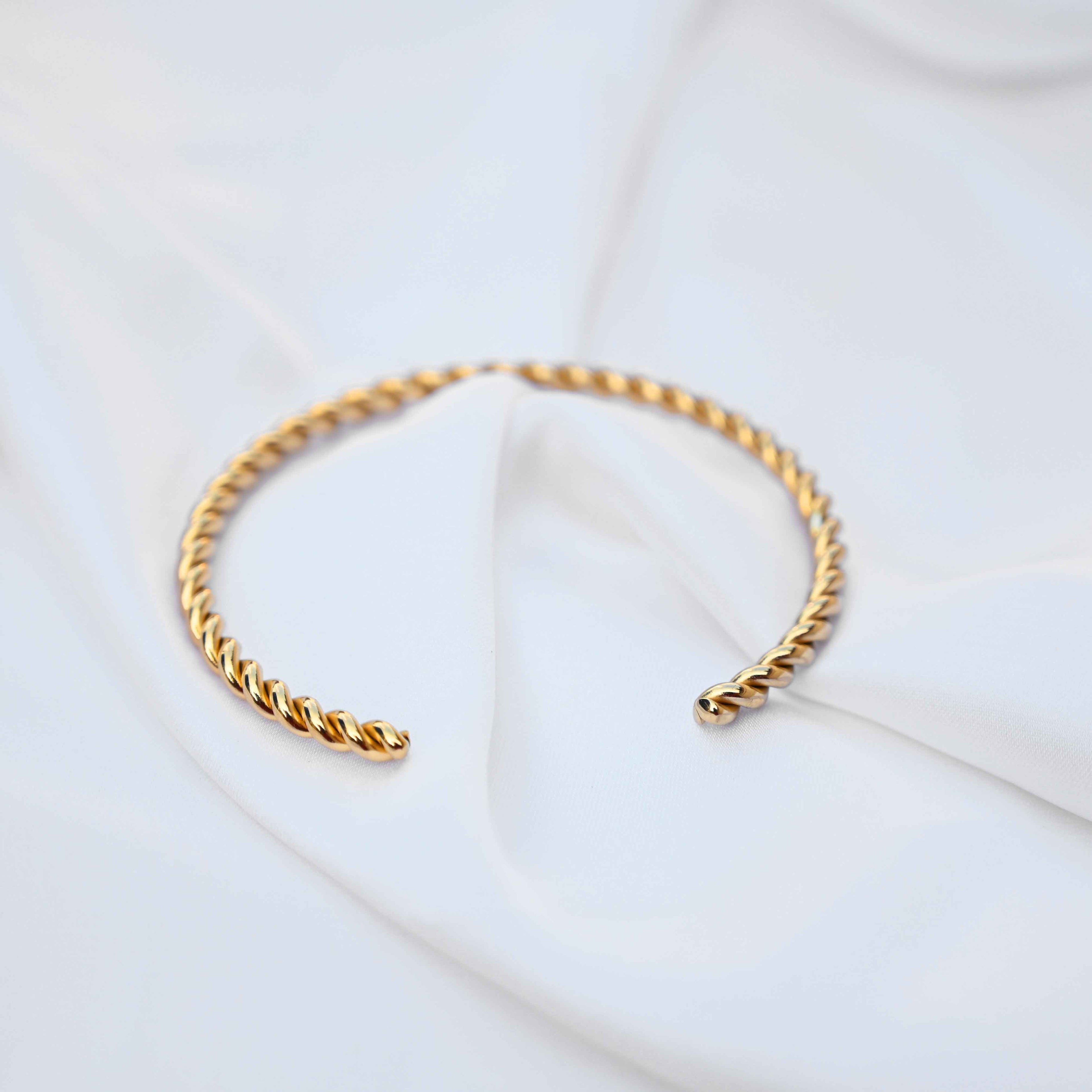 Twisted minimalistic gold bangle: anti Tarnish jewellery
