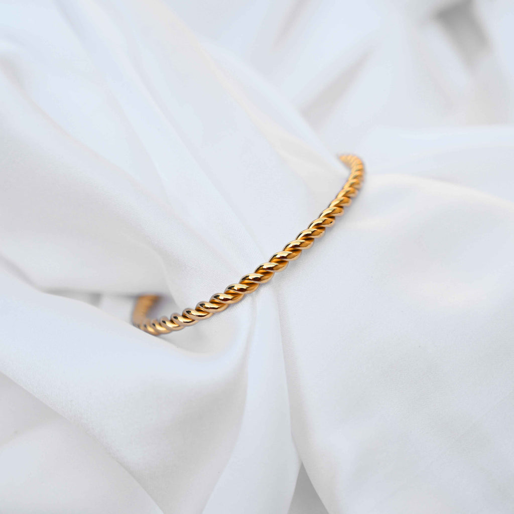 Twisted minimalistic gold bangle: anti Tarnish jewellery