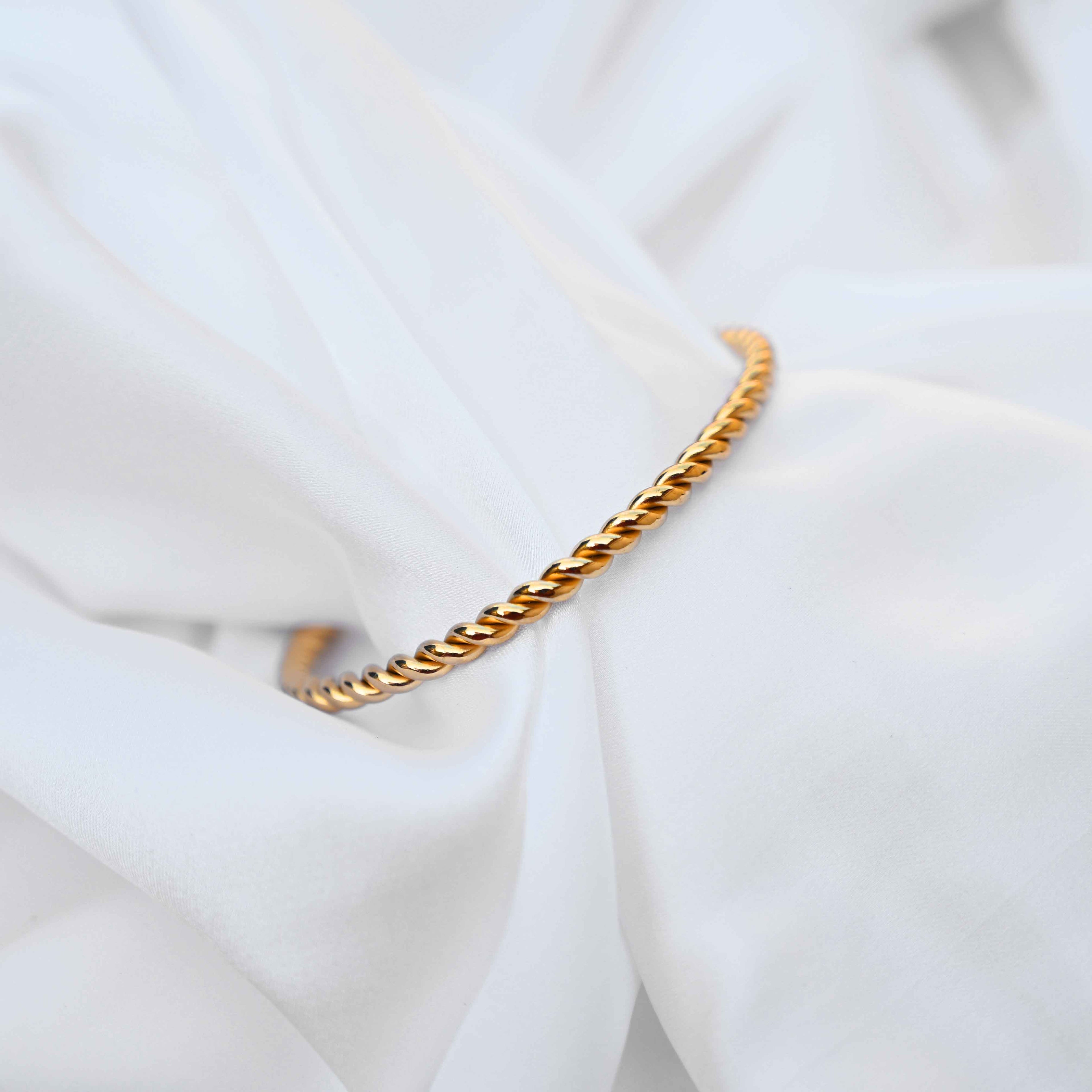Twisted minimalistic gold bangle: anti Tarnish jewellery