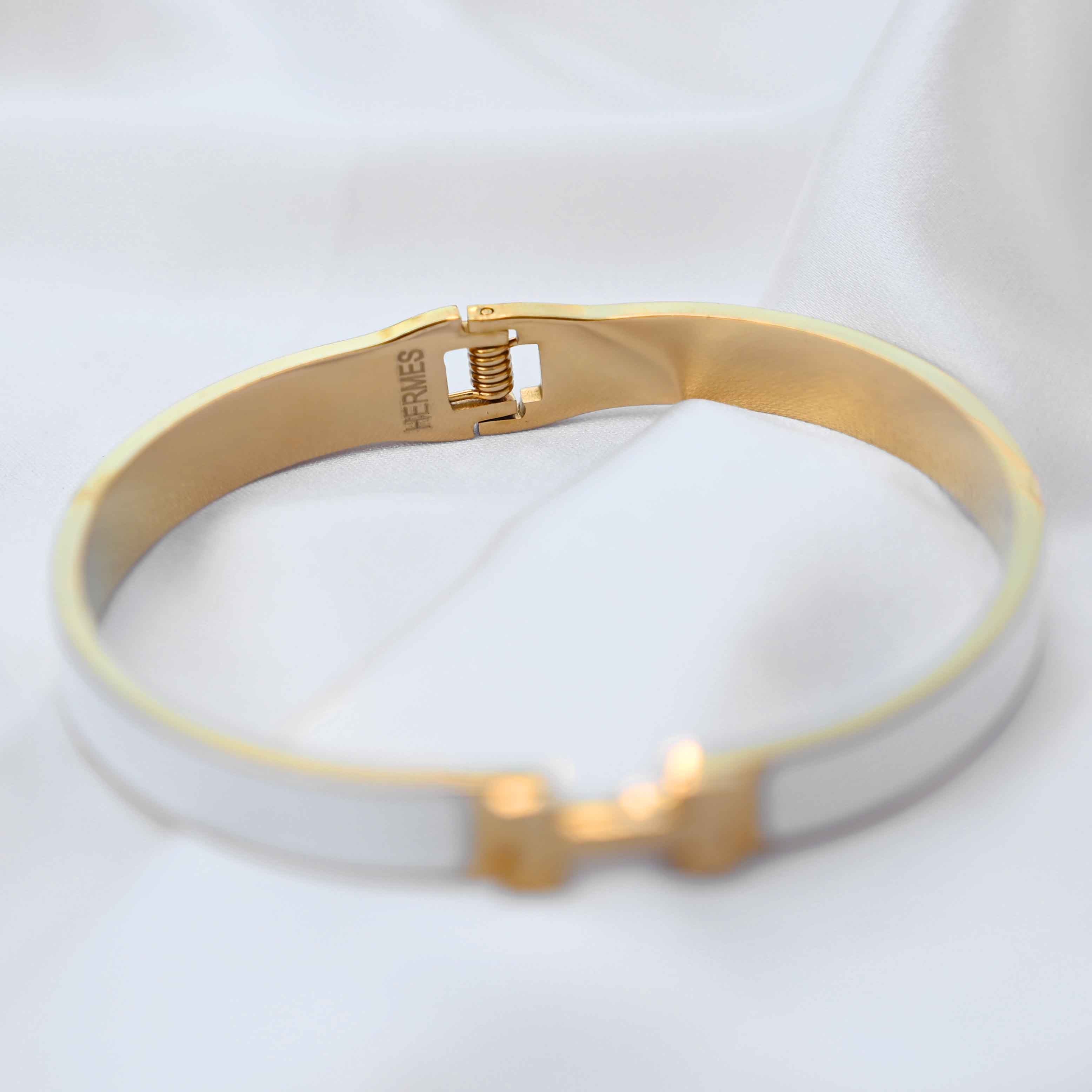 gold Hermes logo signature bracelet