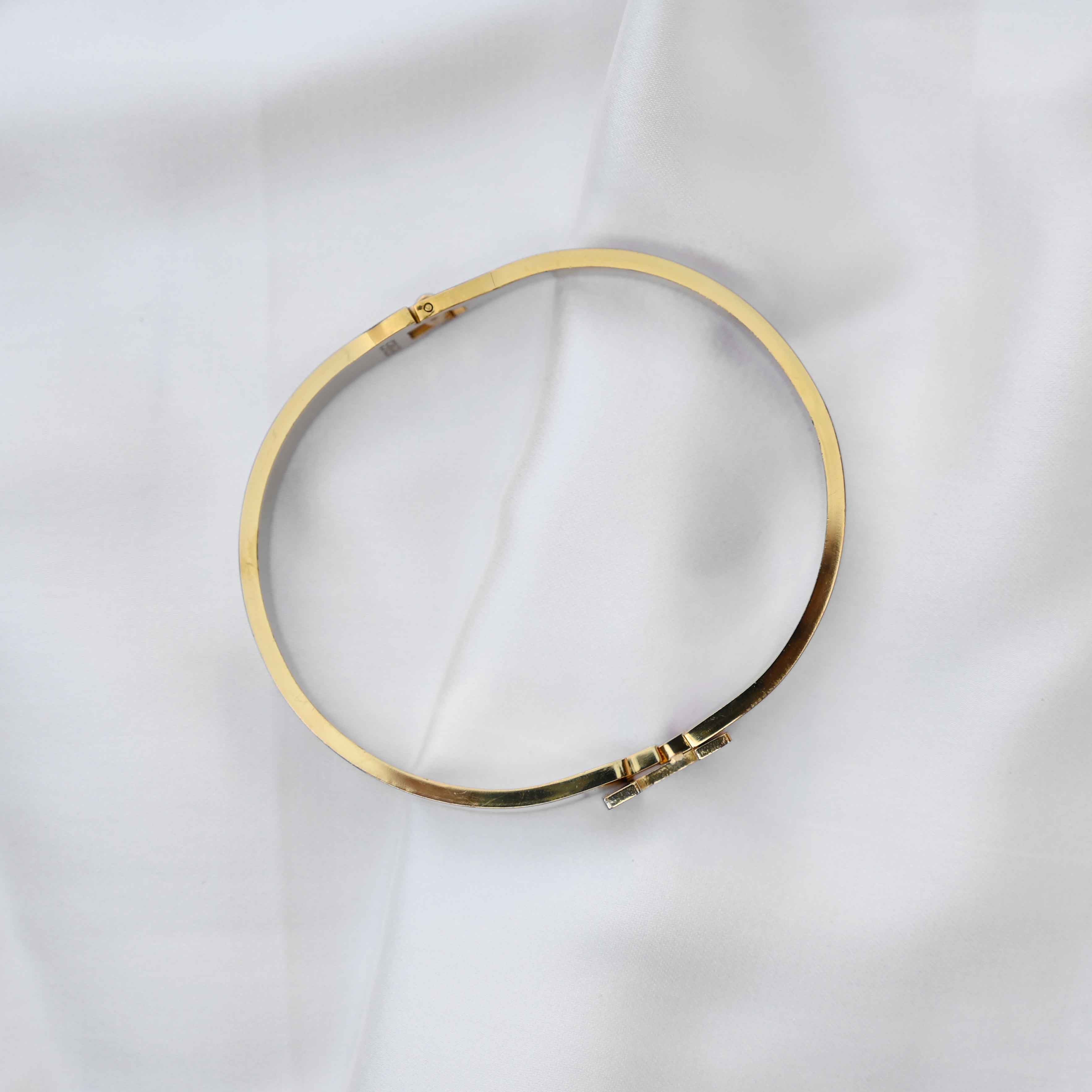 gold Hermes logo signature bracelet