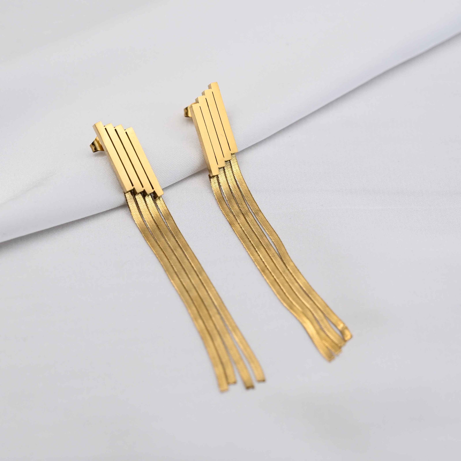 Long Drop serpent chain earrings in gold