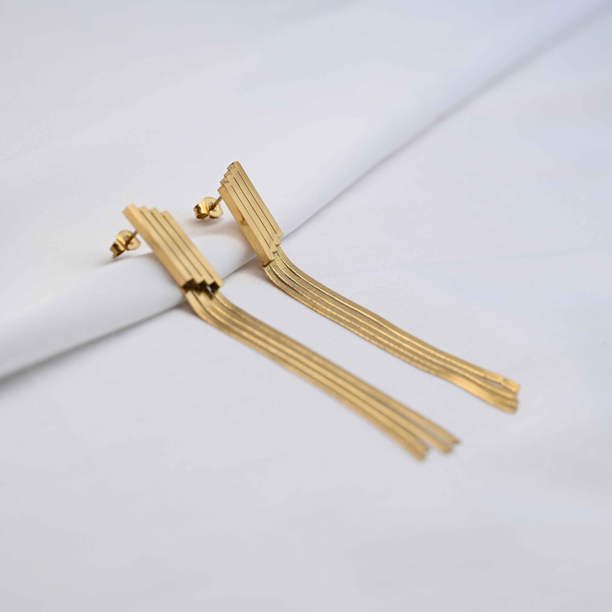 Long Drop serpent chain earrings in gold