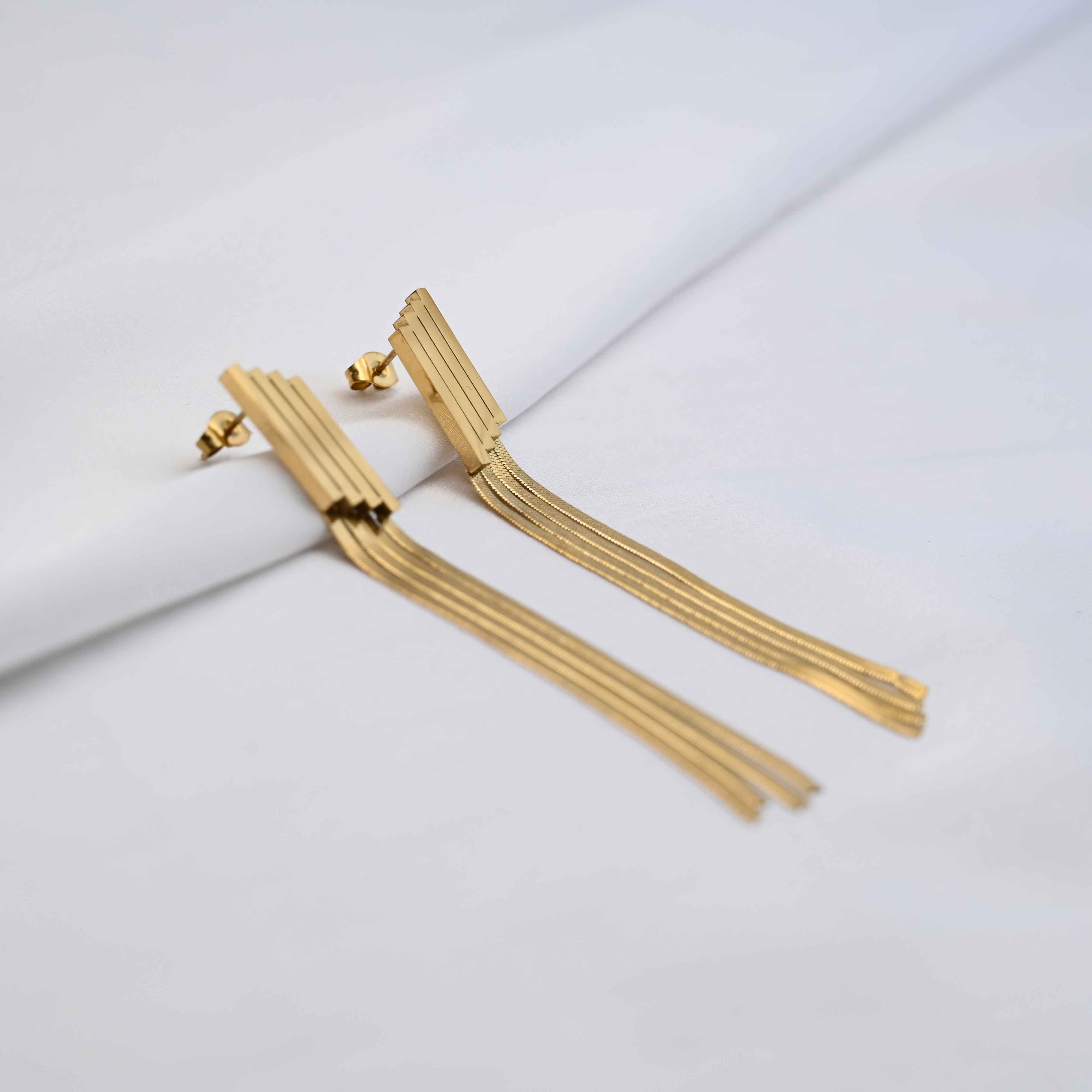 Long Drop serpent chain earrings in gold