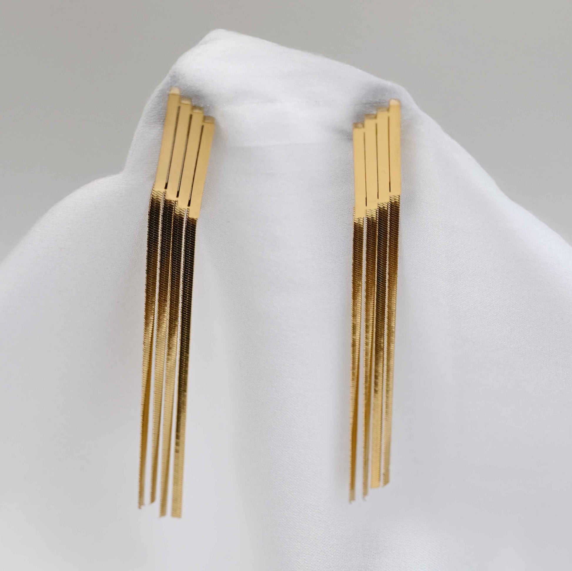 Long Drop serpent chain earrings in gold