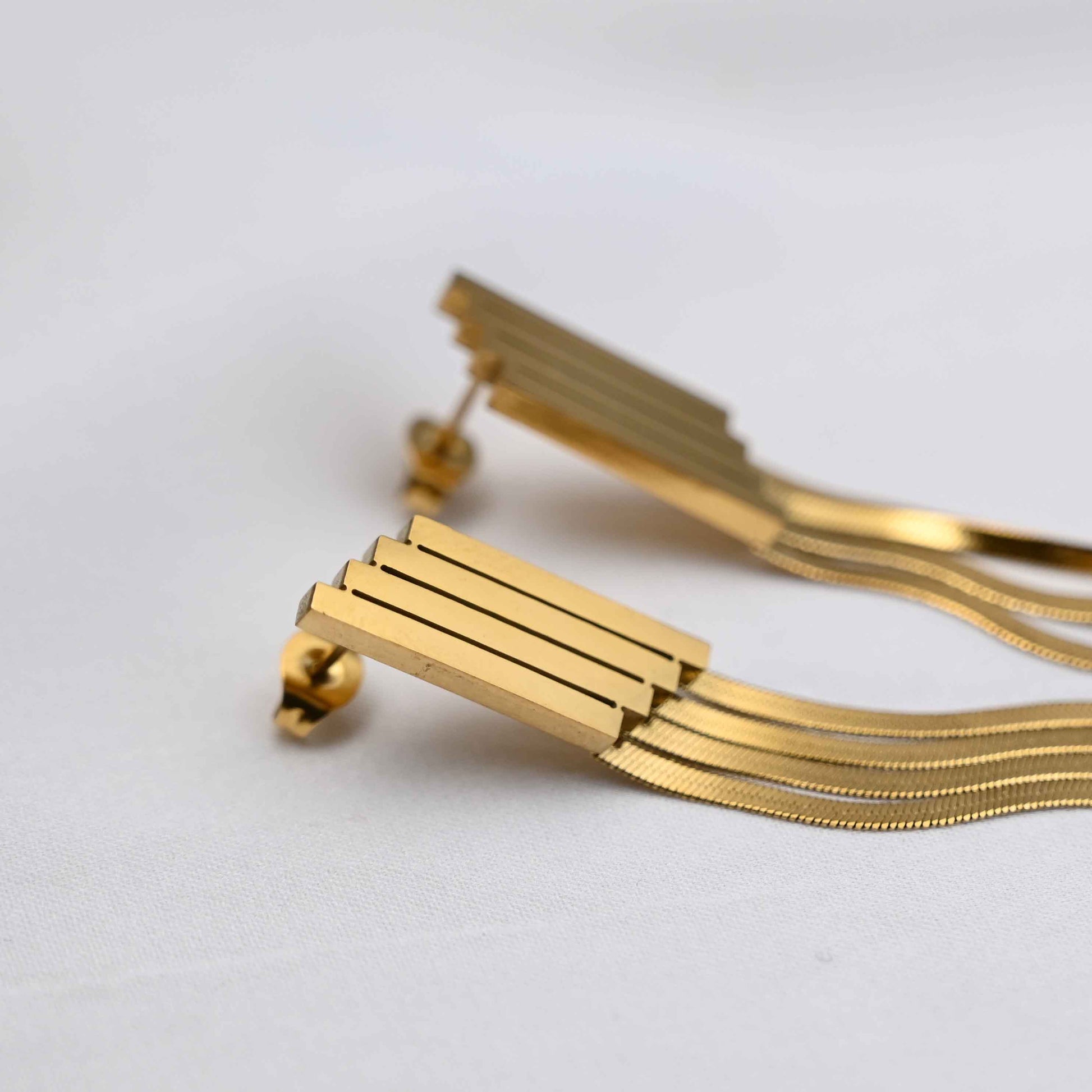 Long Drop serpent chain earrings in gold