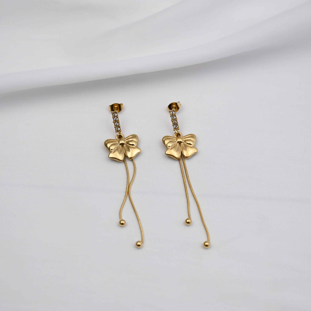 Dangling bows earrings in gold