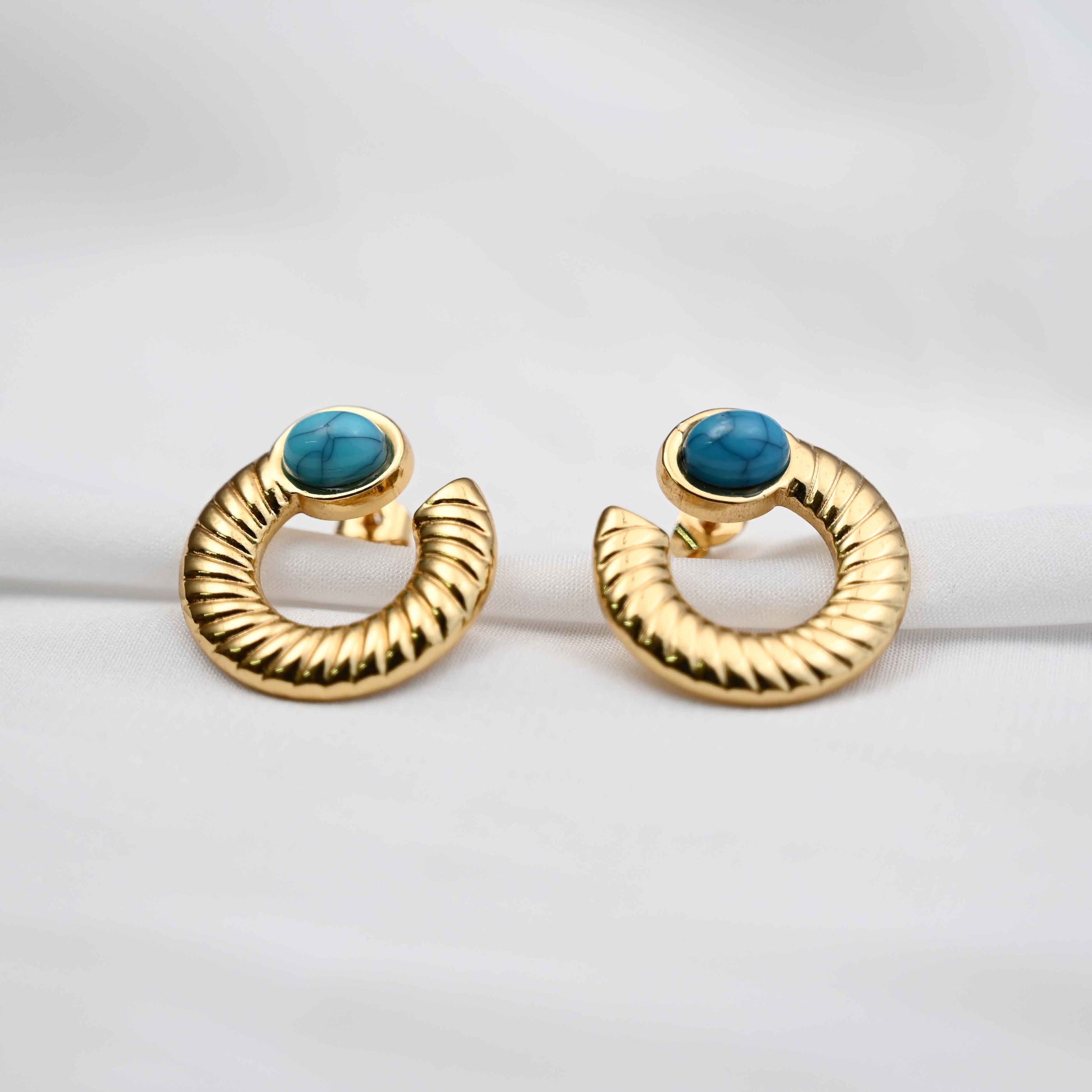 Turquoise loop stud earrings in gold with blue stone