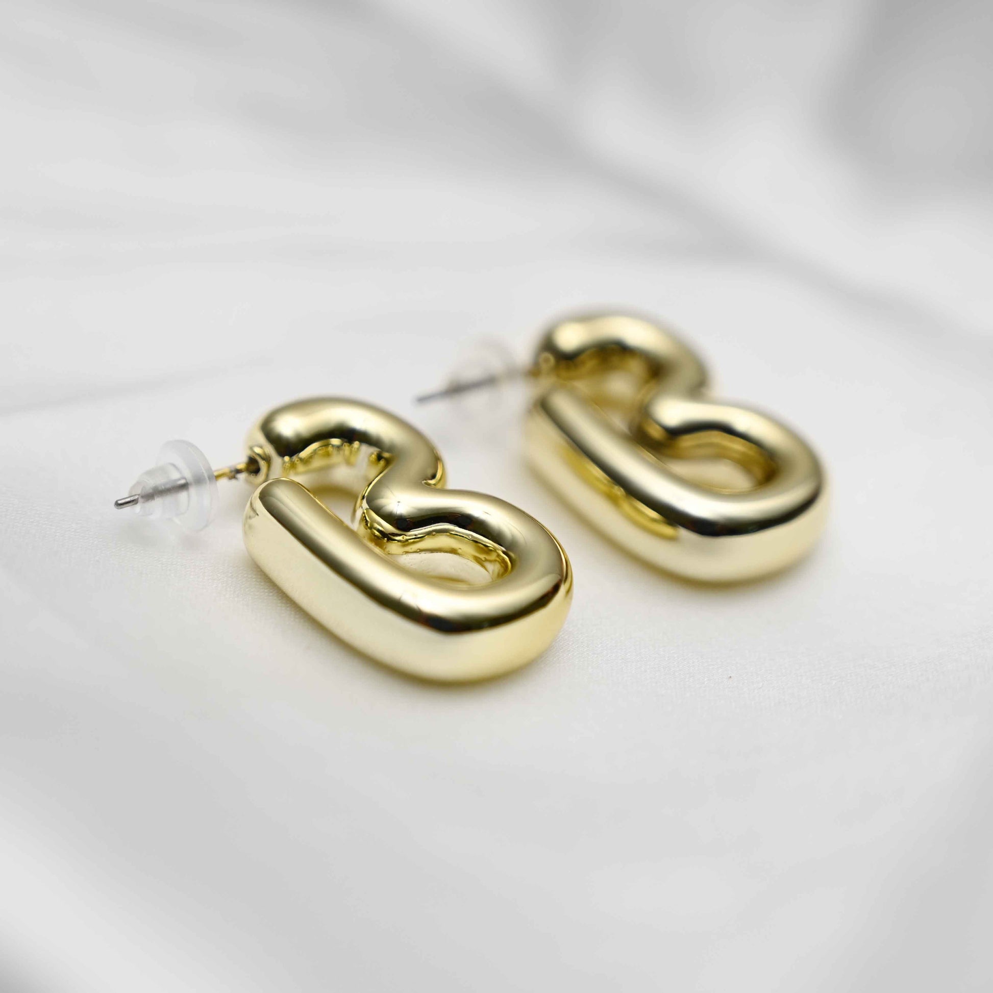Gold inflated earring
