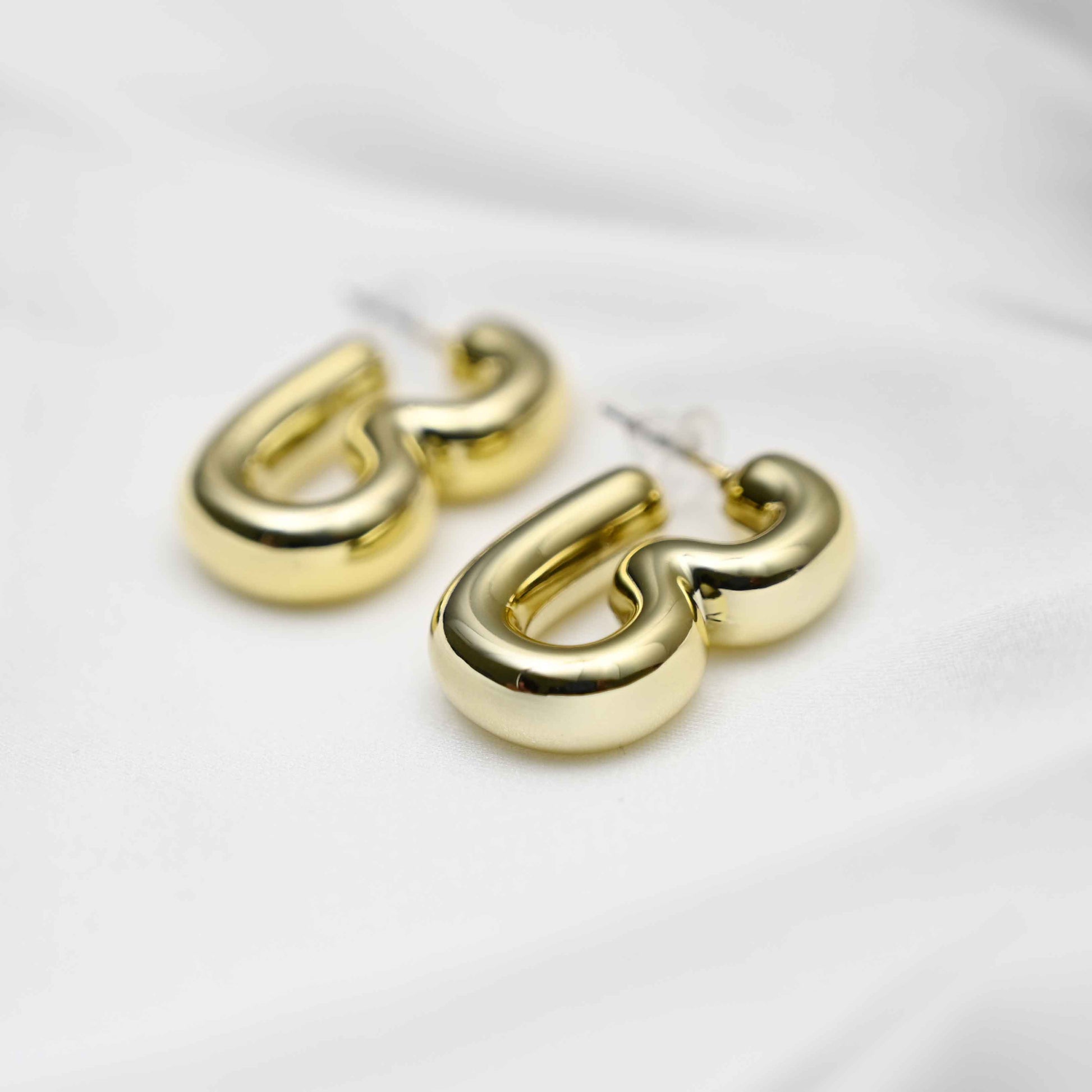 Gold inflated earring