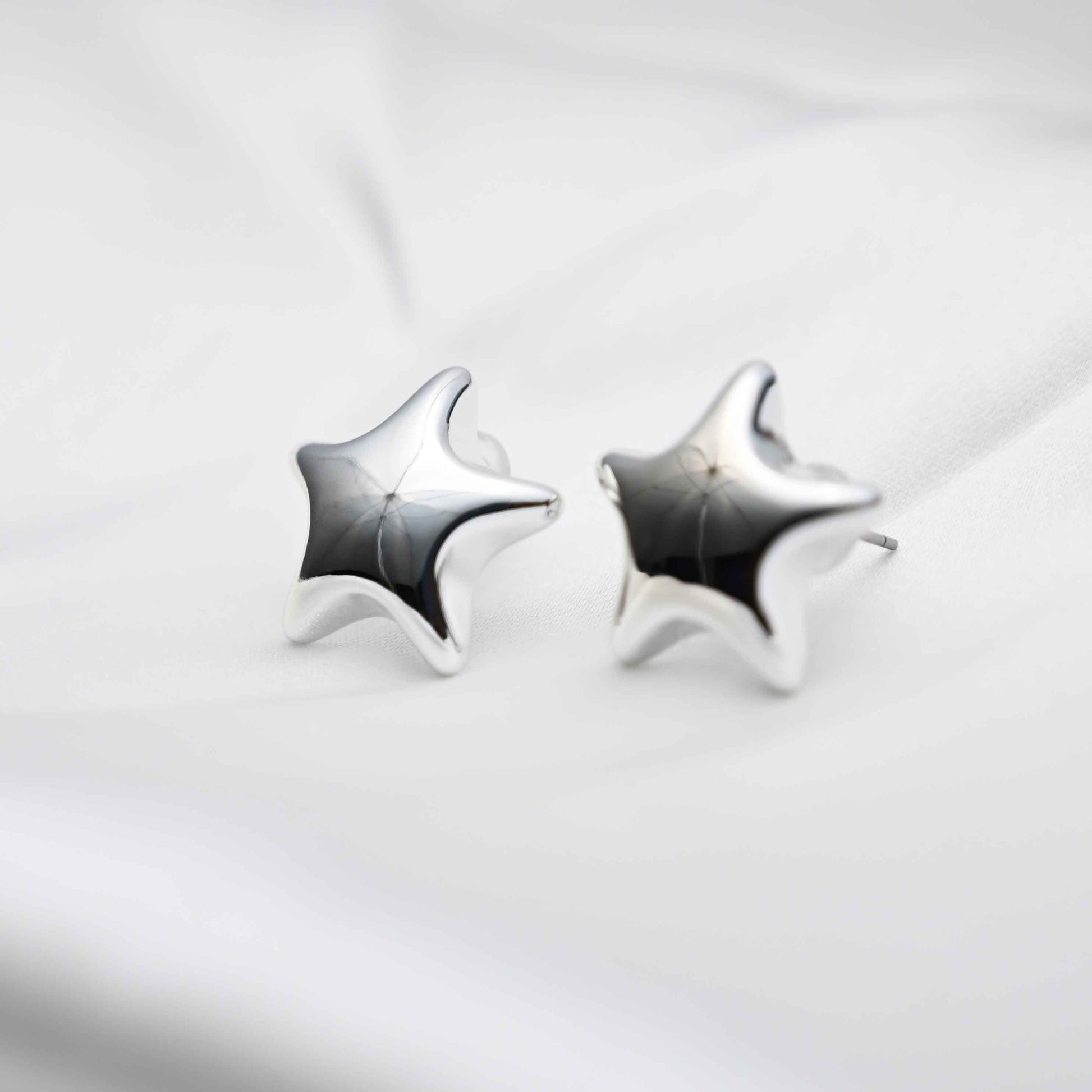 Silver star earring