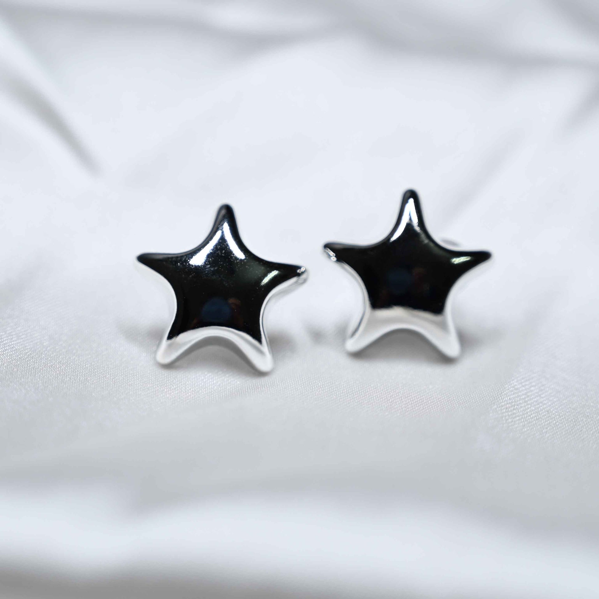Silver star earring