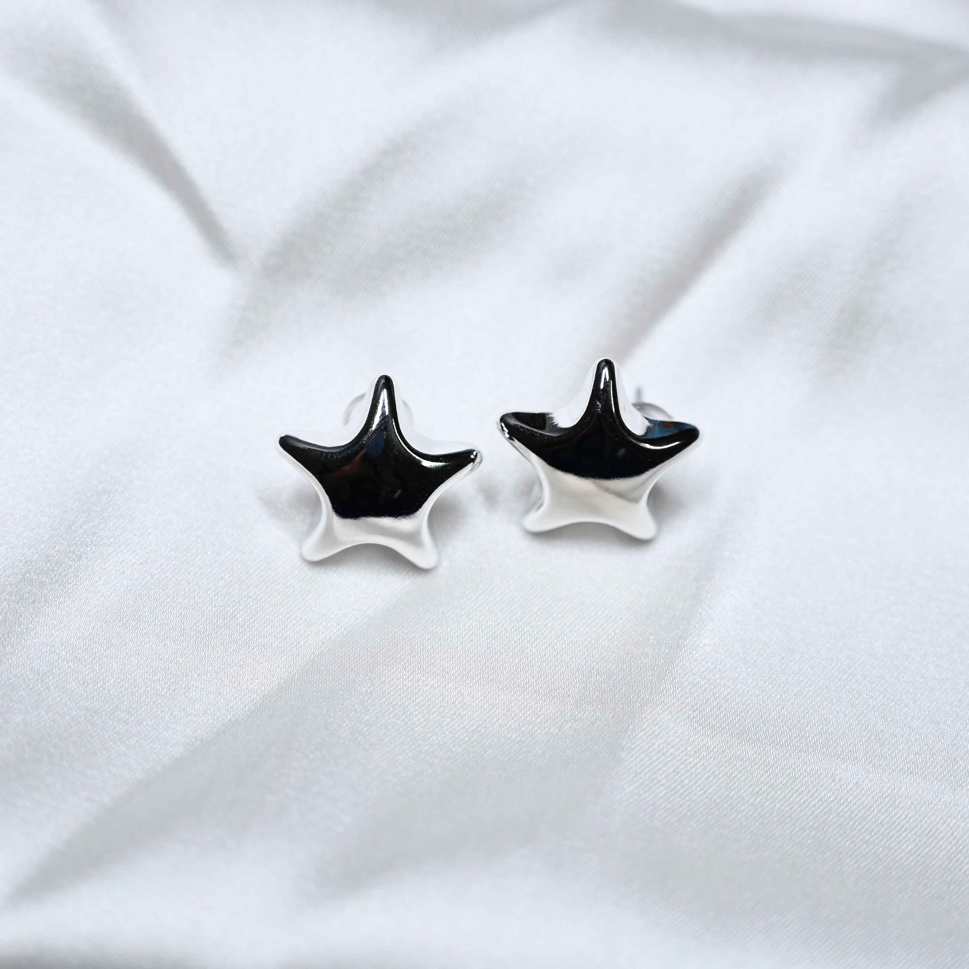 Silver star earring